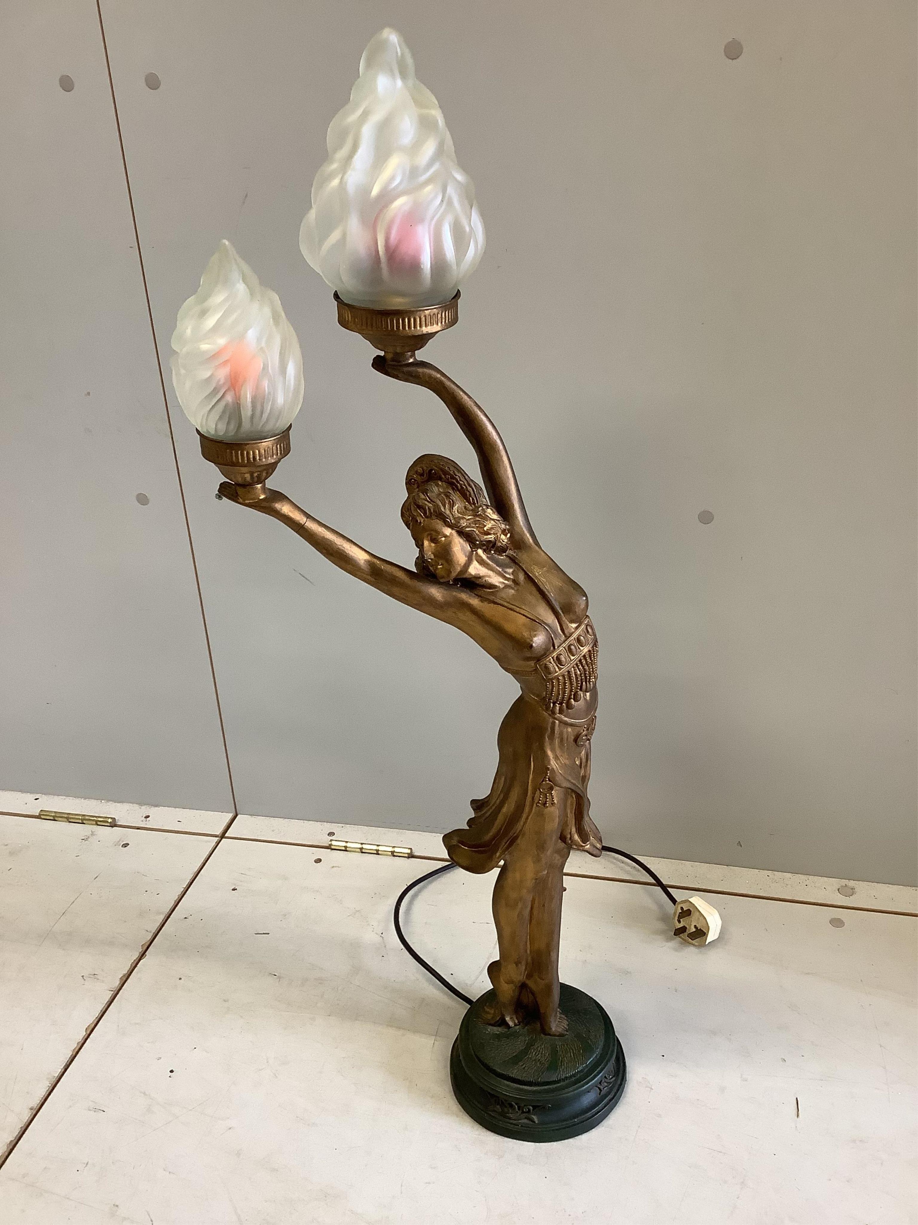 An Art Nouveau gilt composition figural tablelamp with opaque glass flambé shades, height 92cm. Condition - fair.